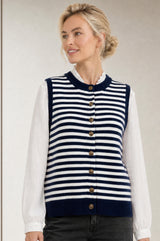 Model wearing the Aspiga Merino Wool Stripe Button Knit Gilet in Navy/Off White, a breton-striped button-front knit gilet, front view
