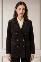 Model wearing the Aspiga Double Breasted Corduroy Blazer in Chocolate Brown, a tailored corduroy blazer with a peak lapel and double-breasted button front, front view
