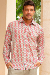 A model wearing a long-sleeved, pink and khaki geometric patterned cotton shirt with a classic collar.