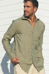 A man in a linen khaki shirt green