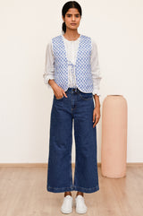 Arlo quilted jacket with a flower stamp in cornflower blue and white with a white border and tie front