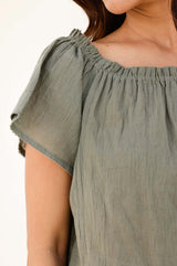 Zoom in Khaki Ilana cotton short sleeve top with shirred neckline and elasticated neckline