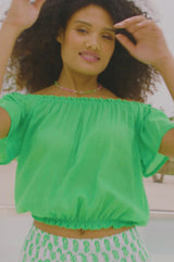 Video of bright green ilana green of the shoulder with short sleeves, and an elasticated waistband and neckline