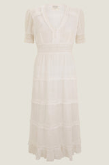 White midi dress with lace trim around the short sleeve, v neckline lace waistband and raw edge frill details. Cutout shot on white background