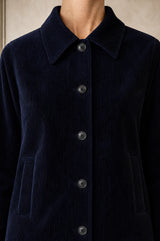 Close-up of the collar and button placket of the Aspiga Corduroy Collared Jacket in Deep Navy