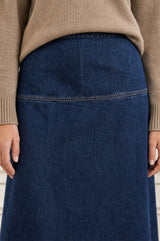 Close-up of the waistband seam detail of the Aspiga Dropped Waist Denim Skirt in Indigo