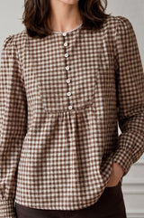 Close-up of the button placket and scalloped collar of the Aspiga Mina Gingham Check Blouse in Chocolate/White