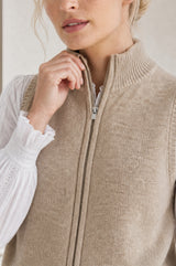 Close-up of the zip and collar detail of the Aspiga Merino Wool Zip Through Gilet in Taupe