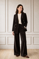 Model wearing the Aspiga Wide Leg Chunky Corduroy Trouser in Chocolate Brown, a high-waisted wide-leg corduroy trouser with patch pockets, alternate view