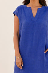 Zoom in of th Dori Linen mini dress in cobalt blue with capped sleeves, concealed side pockets with a small v-neck