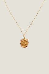 Close-up of the sun-motif pendant and multicolour beaded surround of the Aspiga Riviera Necklace