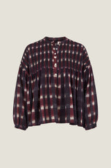 Product photo of the Aspiga Mine Ikat Blouse in Wine, flat lay on a beige background