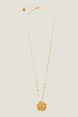 Product photo of the Aspiga Tuti Frutti Necklace, a gold necklace with a round palm tree pendant surrounded by multicolour beads